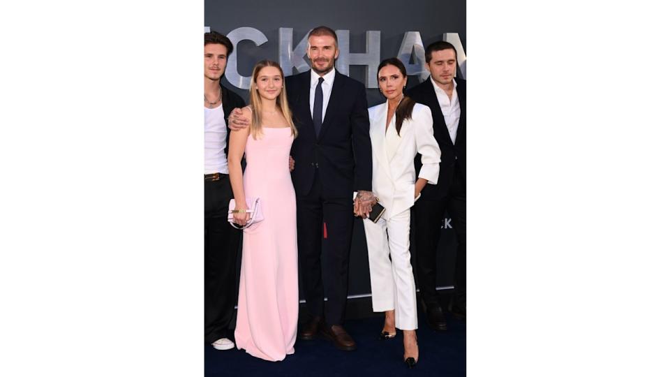 Harper wore a pastel pink gown with straight hair at a red carpet event alongside her family. Her soft, glamorous look blended seamlessly with the rest of the well-dressed Beckhams.