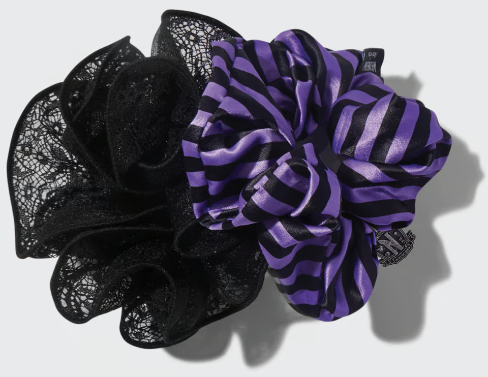 black lace scrunchie under a purple and black striped scrunchie 