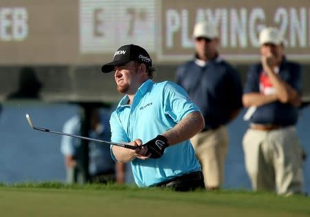 Mar 5, 2015; Miami, FL, USA; J.B. Holmes hits his second shot in a bunker on the ninth hole during the first round of the WGC - Cadillac Championship golf tournament at TPC Blue Monster at Trump National Doral. Mandatory Credit: Jason Getz-USA TODAY