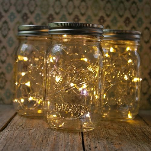 For a magic rustic feel fill mason jars with LED lights.