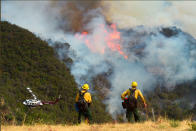 <p>Los Padres National Forest firefighters watch as helicopters work on the northeast flank of the Whittier fire near Hot Spring Canyon outside Cachuma Lake, California, U.S. July 11, 2017. (Mike Eliason/Santa Barbara County Fire/Handout via Reuters) </p>