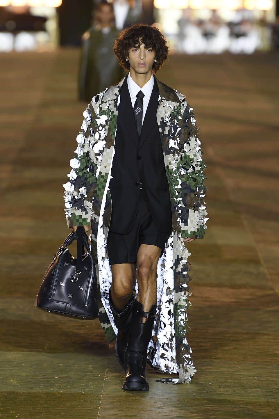 a model on the runway at the louis vuitton menswear collection fashion show on june 20, 2023 in paris, france photo by giovanni giannoniwwd via getty images