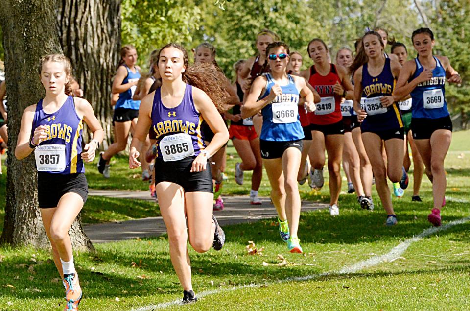 Watertown's Kate McElroy (left) and Victoria Smith compete in the varsity girls'  5,000-meter race Thursday, Sept. 29, 2022 during the Watoma Invitational cross country meet at Cattail Crossing Golf Course.