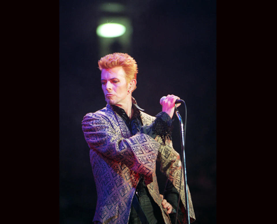 David Bowie performs during a concert celebrating his 50th birthday, at Madison Square Garden in New York on Jan. 9, 1997.