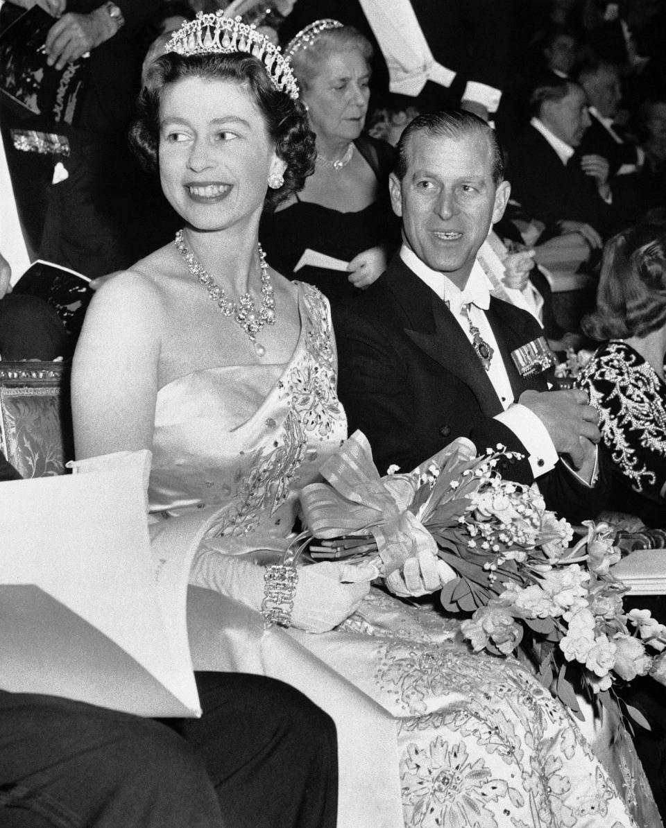 FILE - Queen Elizabeth II appears with her husband, Prince Philip, Duke of Edinburgh, at the Empire Theatre in London for the world premiere of the film "Dunkirk," on March 20, 1958. (AP Photo, File)