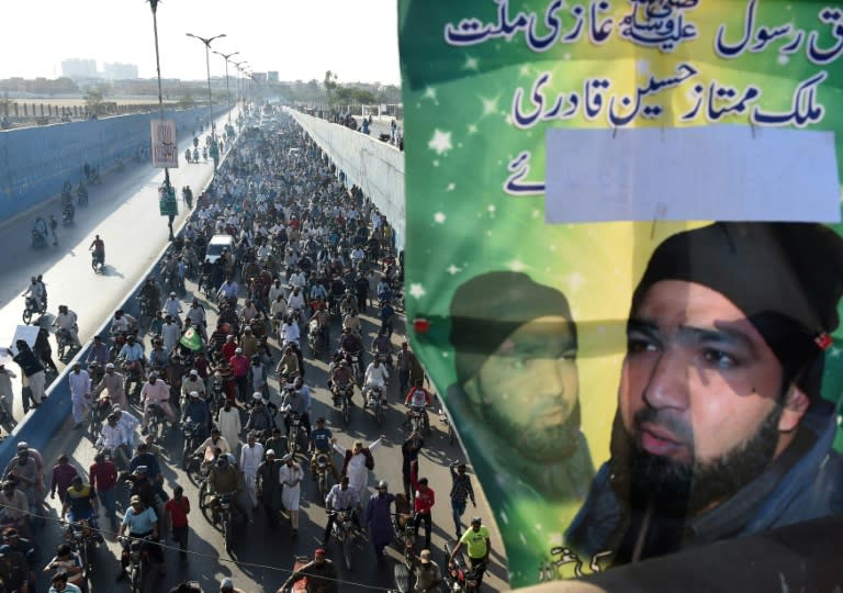 Pakistani demonstrators march during a protest against the execution of convicted murderer Mumtaz Qadri in Karachi on February 29, 2016