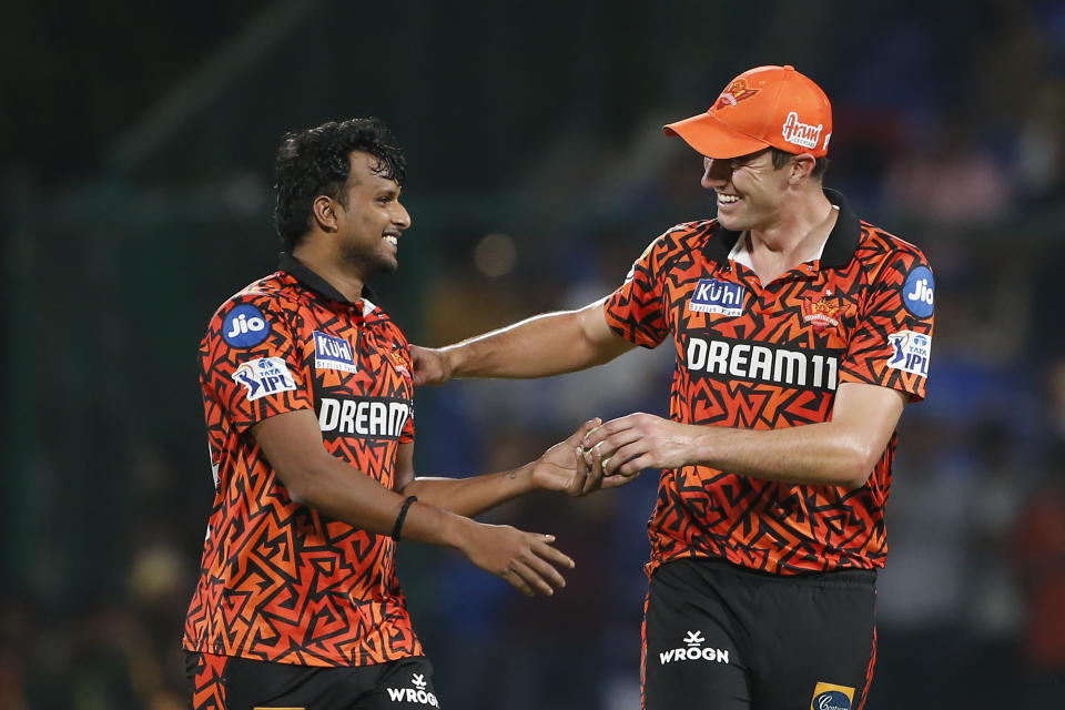 Sunrisers Hyderabad's Pat Cummins congratulates bowler T. Natarajan for taking the wicket of Delhi Capitals' Axar Patel during the Indian Premier League cricket match between Delhi Capitals and Sunrisers Hyderabad in New Delhi, India, Saturday, April 20, 2024. (AP Photo/Surjeet Yadav)