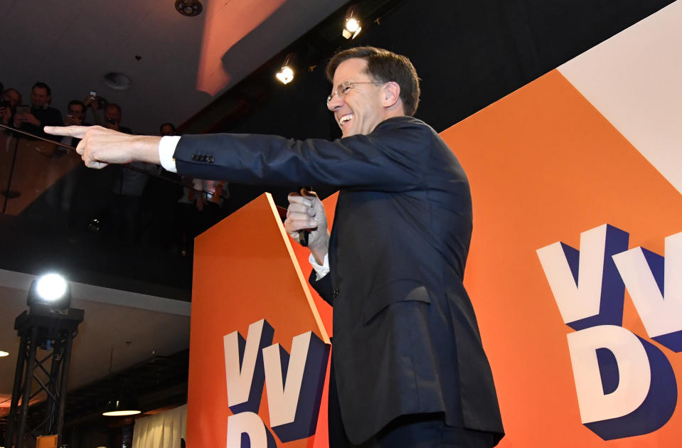 Prime Minister Mark Rutte of the free-market VVD party celebrates after exit poll results of the parliamentary elections were announced in The Hague, Netherlands, Wednesday, March 15, 2017. (AP Photo/Patrick Post)