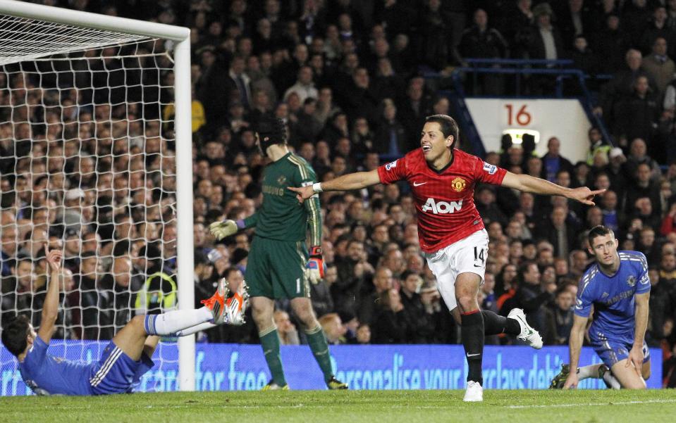 Manchester United's Javier Hernandez, center, celebrates his goal against Chelsea during their English Premier League soccer match at Stamford Bridge, London, Sunday, Oct. 28, 2012. (AP Photo/Sang Tan)