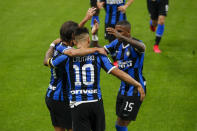 Inter Milan's Lautaro Martinez, center, celebrates with his teammates after he scored his side's second goal during the Serie A soccer match between Inter Milan and Sampdoria at the San Siro Stadium, in Milan, Italy, Sunday, June 21, 2020. (AP Photo/Antonio Calanni)