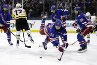 New York Rangers center Mika Zibanejad (93) is tripped by Pittsburgh Penguins center Jeff Carter during the third period in Game 7 of an NHL hockey Stanley Cup first-round playoff series Sunday, May 15, 2022, in New York. (AP Photo/Adam Hunger)