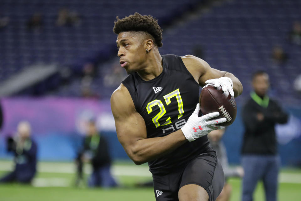 FILE - In this Feb. 28, 2020, file photo, Wisconsin running back Jonathan Taylor runs a drill at the NFL football scouting combine in Indianapolis. (AP Photo/Michael Conroy, File)