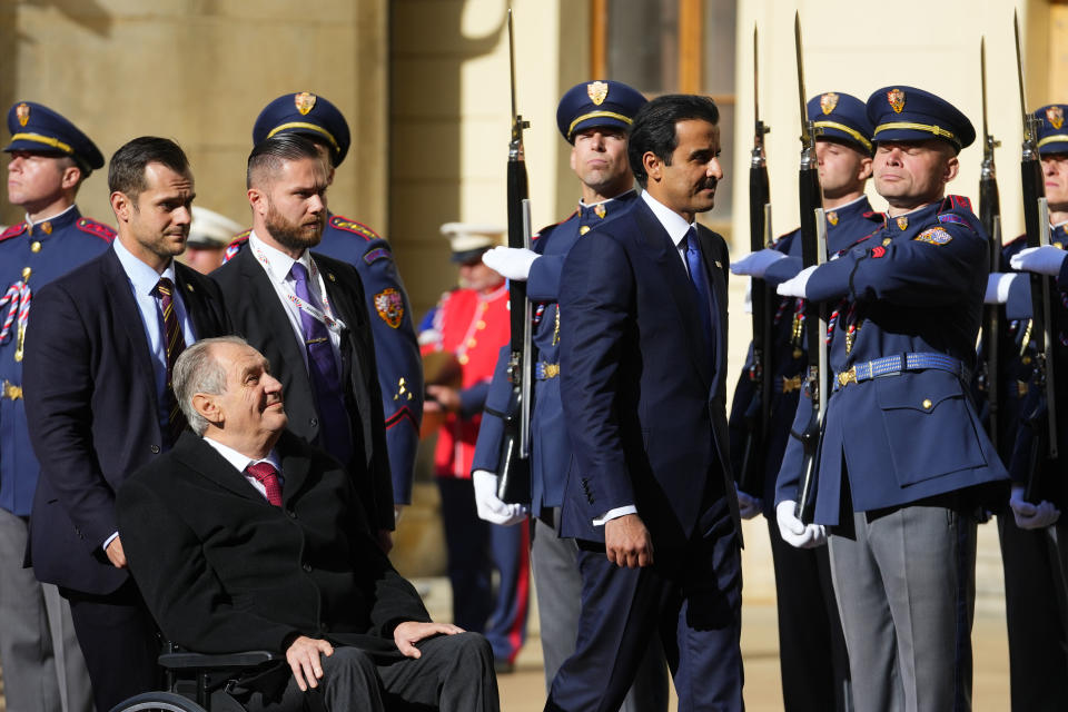 Czech Republic's President Millos Zeman, left, welcomes Qatari Emir Sheikh Tamim Bin Hamad Al-Thani at the Prague Castle in Prague, Czech Republic, Wednesday, Oct. 5, 2022. (AP Photo/Petr David Josek)