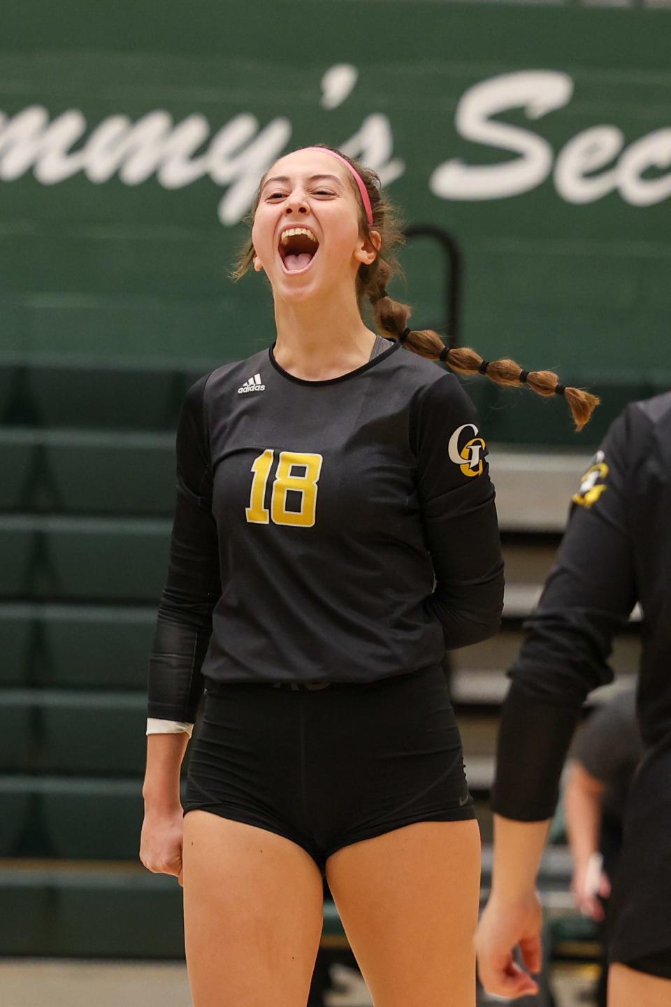 Garfield junior Madeline Shirkey celebrates after a point during Wednesday night’s Division III District Semifinal game against Lake Center Christian High School in Medina.