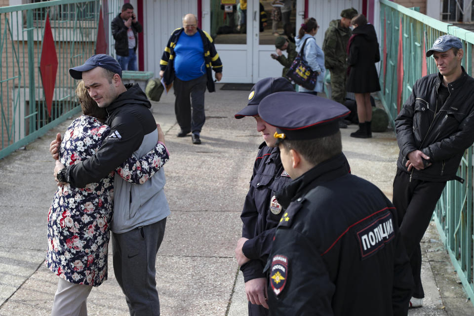 FILE - A Russian recruit hugs his mother at a military recruitment center in Volgograd, Russia, Saturday, Sept. 24, 2022. (AP Photo/File)