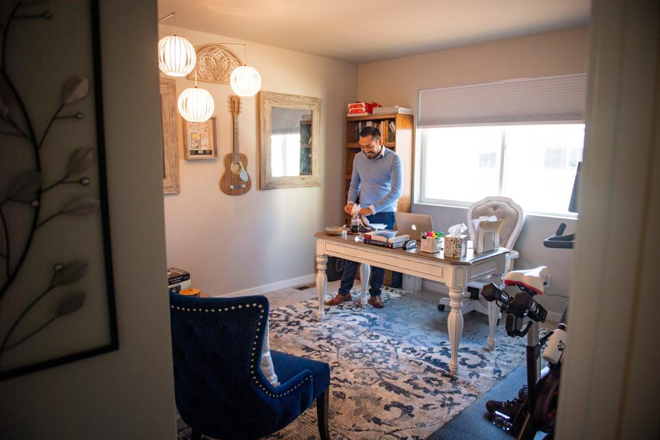 Richard C. Martinez works in his home office in Ault on Oct. 5.