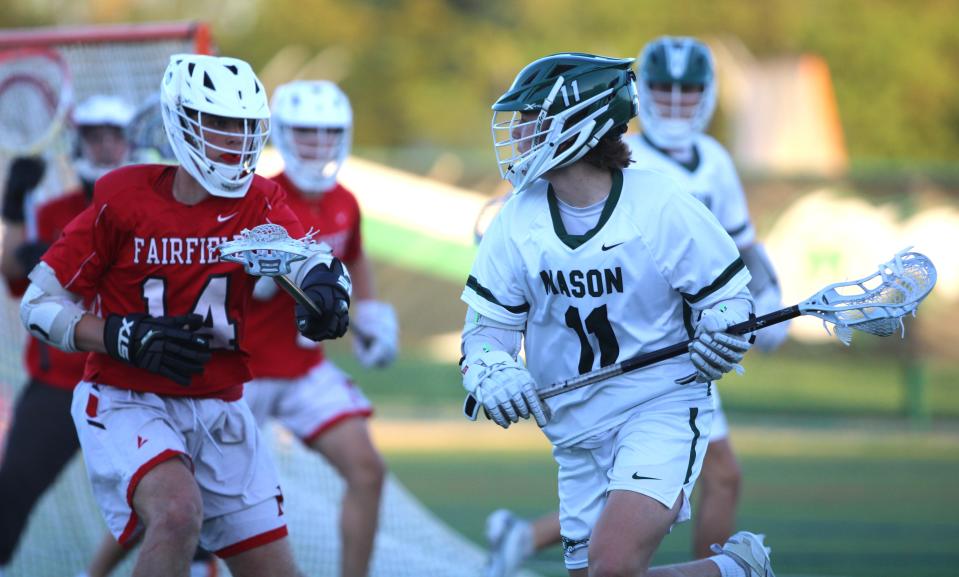 Mason junior Quinn Riley (11) looks to pass as Fairfield defenders close in. Mason is looking to improve on reaching the regional semifinals, which it has done each of the past four seasons.