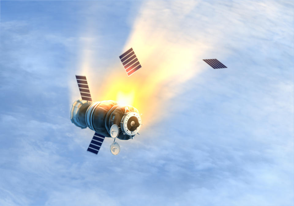 Satellite burning up in atmosphere