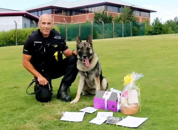 On the mend: Audi's handler PC Karl Mander, pictured, said the dog did not seem to have suffered lasting damage 