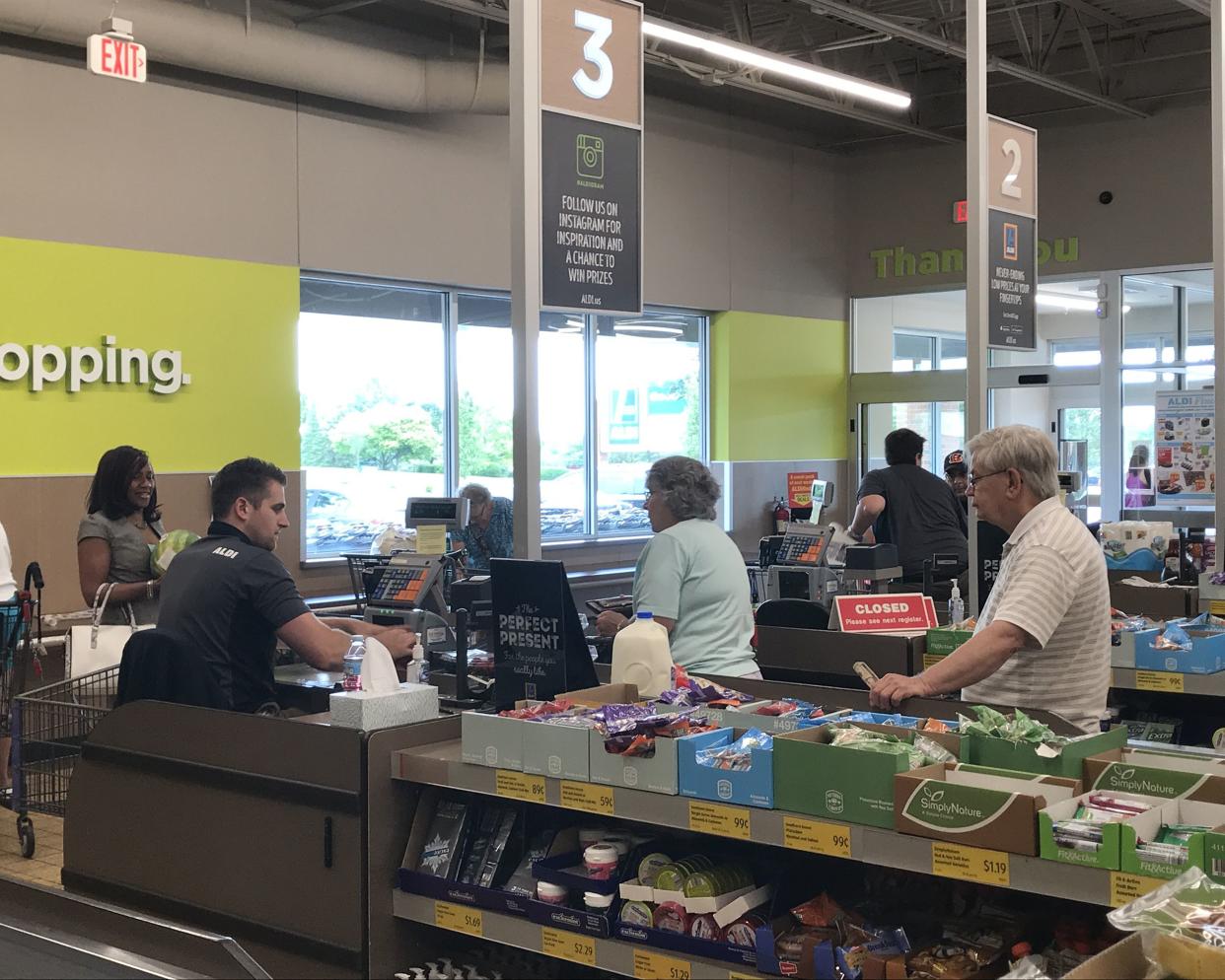 people checking out at Aldi