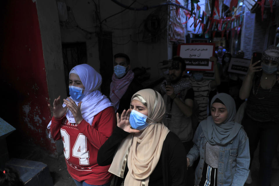 Protesters shout slogans in support of Palestinians in the latest round of violence, in Beirut, Lebanon, Tuesday, May 11, 2021. A confrontation between Israel and Hamas sparked by weeks of tensions in contested Jerusalem escalated Tuesday. (AP Photo/Hussein Malla)