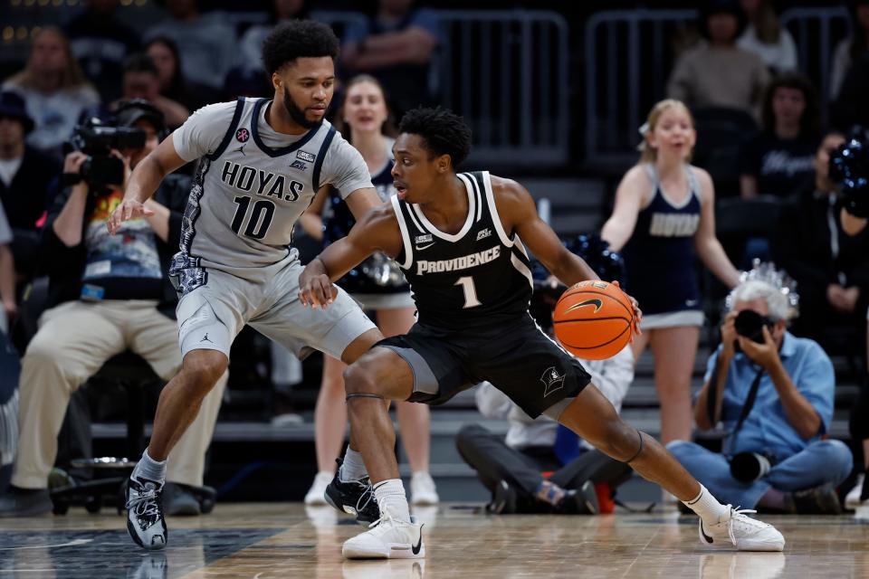 Providence's Jayden Pierre drives to the basket as Georgetown's Jayden Epps defends in the second half of Tuesday's game at Capital One Arena.