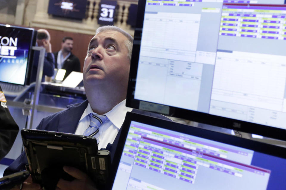 <p>Trader Edward McCarthy works on the floor of the New York Stock Exchange, Aug. 31, 2016. Stocks are opening slightly lower on Wall Street as a thin batch of earnings gave investors little to get excited about. (Photo: Richard Drew/AP)</p>