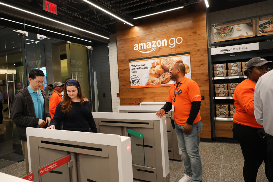 NEW YORK, NEW YORK - MAY 07: People shop at the newly opened Amazon Go Store on May 07, 2019 in New York City. The cashier-less store, the first of this type of store, called Amazon Go, accepts cash and is the 12th such store in the United States located at Brookfield Place in downtown New York. The roughly 1,300-square-foot store sells a variety of food items, prepared meals and Amazon's own meal kits. It is believed that by 2021 Amazon is considering opening up as many as 3,000 of its cashier-free stores across the United States. (Photo by Spencer Platt/Getty Images)