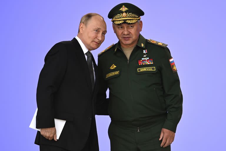 Russia's President Vladimir Putin and Russian Defense Minister Sergei Shoigu attend the opening of the Army 2022 International Military and Technical Forum in the Patriot Park outside Moscow, Russia, Monday, Aug. 15, 2022. Putin vowed to strengthen Russia's military cooperation with its allies. (Sputnik, Kremlin Pool Photo via AP)