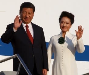 First meeting: Chinese President Xi Jinping and his wife Peng Liyuan arrive in Bali.Picture: AP