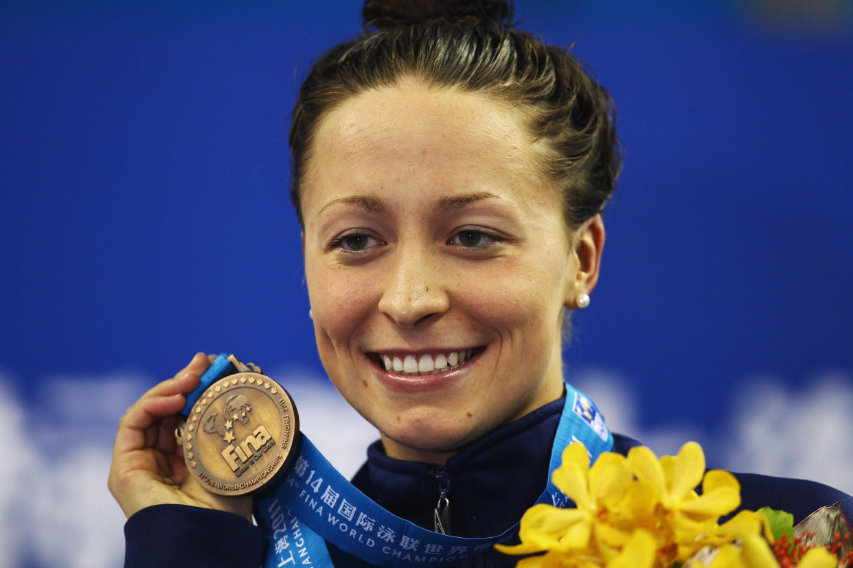 Ariana Kukors holds up her bronze medal for the women's 200-meter individual medley final during the 14th FINA World Championships on July 25, 2011. (Photo: Quinn Rooney/Getty Images)