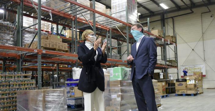 <span class="caption">Claire Babineaux-Fontenot, CEO of the national Feeding America anti-hunger network, meets with Jay Worrall, president of a Pennsylvania food bank.</span> <span class="attribution"><a class="link " href="https://www.gettyimages.com/detail/news-photo/claire-babineaux-fontenot-ceo-of-feeding-america-and-jay-news-photo/1297455257" rel="nofollow noopener" target="_blank" data-ylk="slk:Ben Hasty/MediaNews Group/Reading Eagle via Getty Images;elm:context_link;itc:0">Ben Hasty/MediaNews Group/Reading Eagle via Getty Images</a></span>
