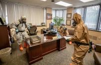 FILE PHOTO: W.Va. Guard sanitizes workspaces for West Virginia Higher Education Policy Commission