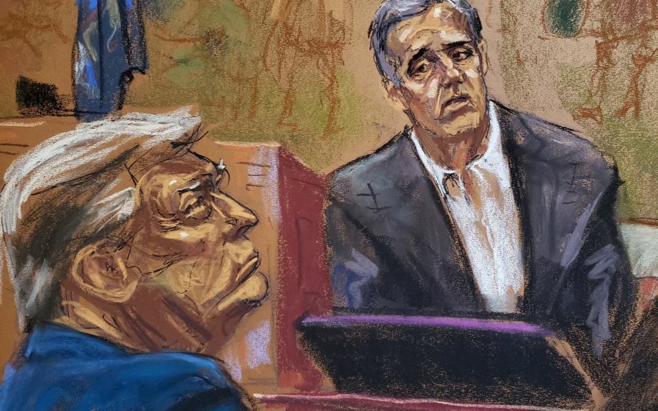 Michael Cohen looks towards former U.S. President Donald Trump as he is questioned by a lawyer for the attorney general's offic