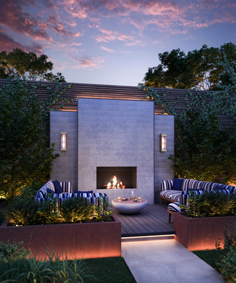 15. Frame an outdoor fireplace with symmetrical wall lights