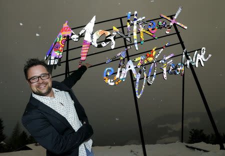 Montreux Jazz Festival Director Mathieu Jaton poses in front of an art installation replicating the poster of the 2016 edition of the festival in the garden of Le Picotin chalet in Caux near Montreux, Switzerland, February 4, 2016. REUTERS/Denis Balibouse