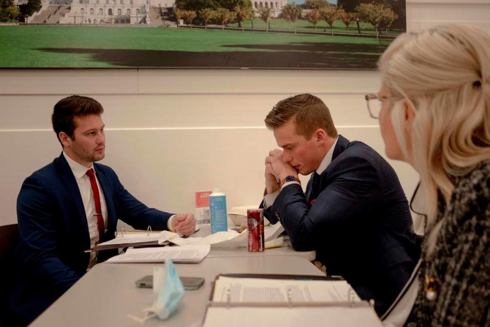 Madison Cawthorn speaks with staff members before the joint session of Congress to confirm Joe Biden’s victory.