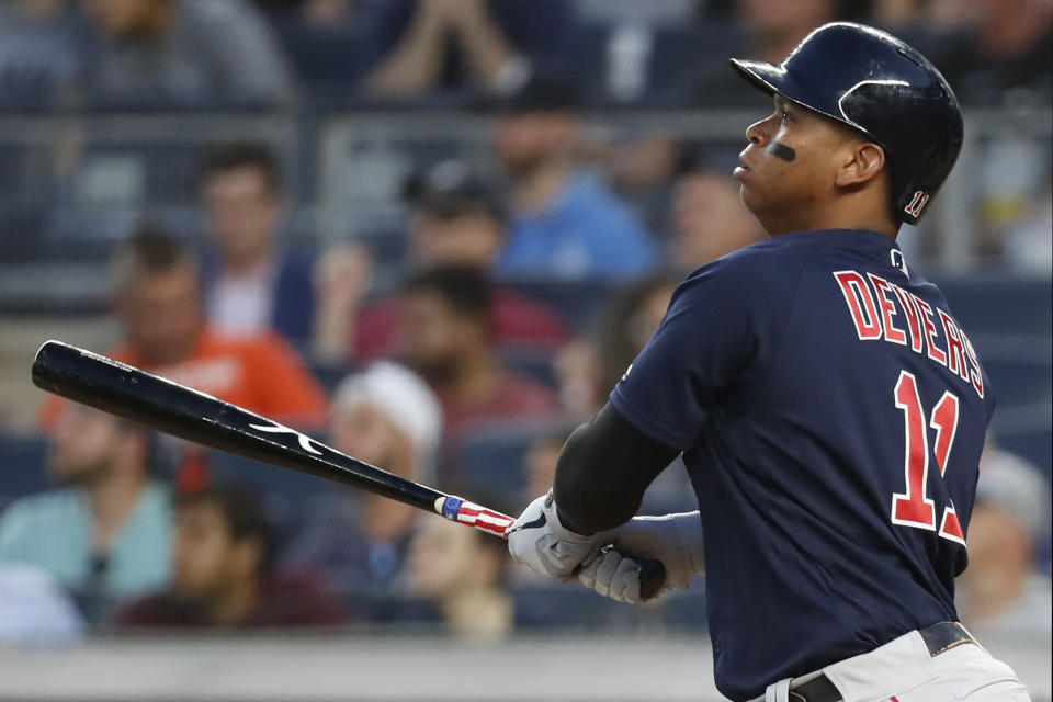 Boston Red Sox Rafael Devers watches his third-inning, two-run home run in the second baseball game of a doubleheader against the New York Yankees, Saturday, Aug. 3, 2019, in New York. (AP Photo/Kathy Willens)