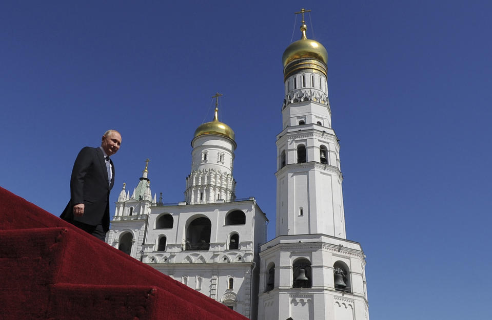 FILE - President Vladimir Putin looks at a military parade after his inauguration ceremony in Moscow on May 7, 2018. Putin begins another term as Russian president in an opulent Kremlin inauguration taking place on Tuesday. (Dmitry Azarov, Sputnik, Kremlin Pool Photo via AP, File)