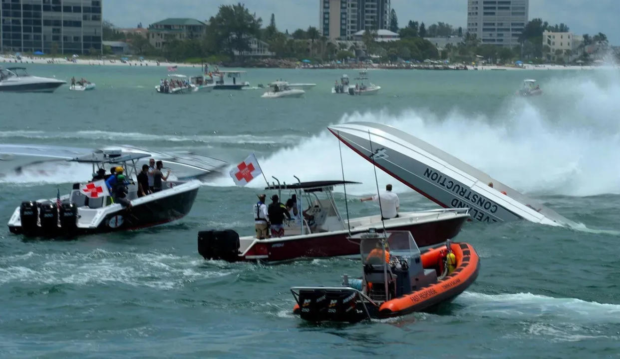 Rescue crews rush to the aid of a speedboater after he crashes in the 2013 Sarasota Powerboat Grand Prix. The driver was not injured.