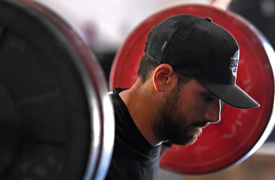 Ken Pozega, the rear tire changer for NASCAR driver Ross Chastain’s Trackhouse Racing pit crew lifts weights during a workout on Tuesday, June 11, 2024.
