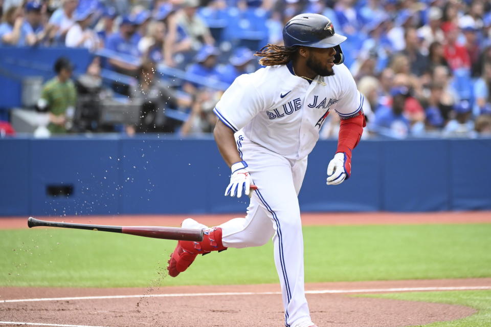 Toronto Blue Jays' Vladimir Guerrero Jr. runs out a single off Detroit Tigers starting pitcher Drew Hutchison in the first inning of a baseball game in Toronto, Saturday, July 30, 2022. (Jon Blacker/The Canadian Press via AP)