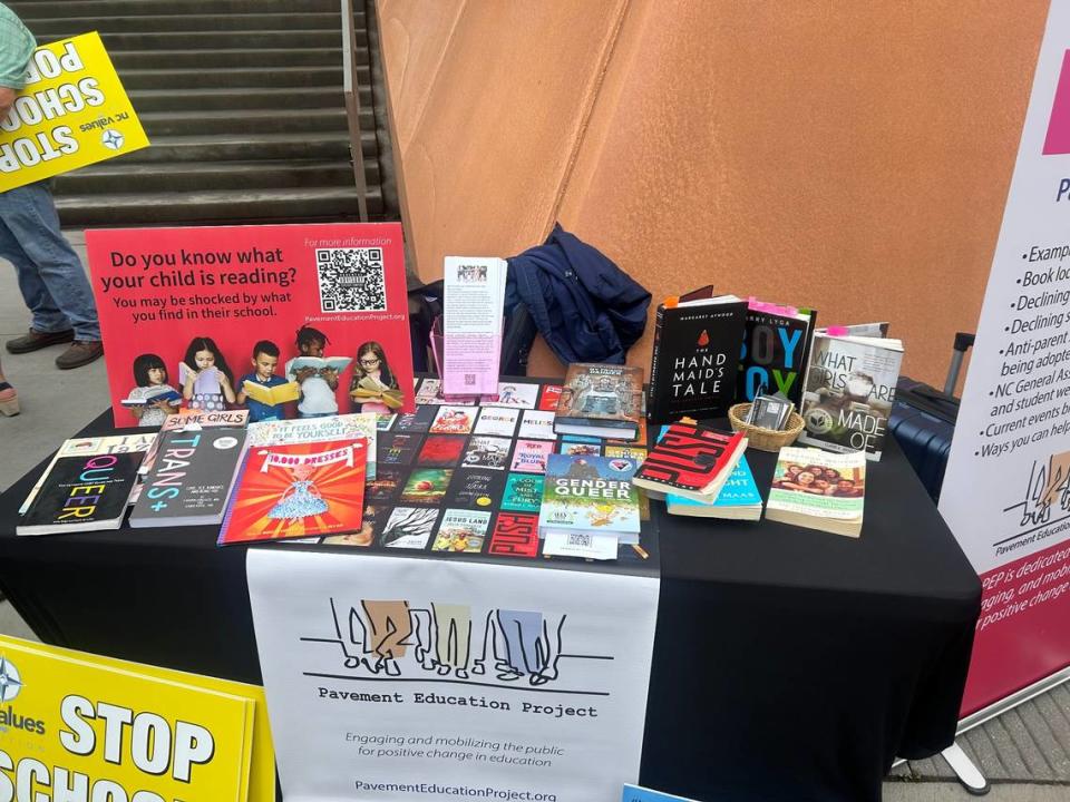 The Pavement Education Project displays books it says are not appropriate to be in schools at a news conference at Freedom Park in Raleigh, N.C., on May 15, 2024.