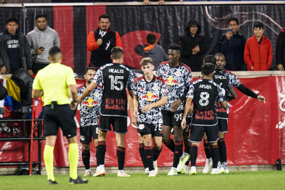 New York Red Bulls players celebrate after a goal against Toronto FC during an MLS soccer match Saturday, Oct. 7, 2023, in Harrison, N.J. (AP Photo/Eduardo Munoz Alvarez)