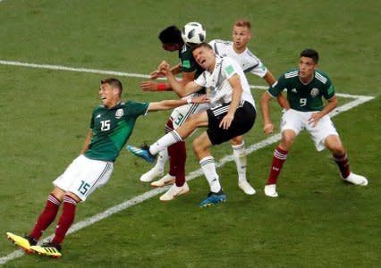 Soccer Football - World Cup - Group F - Germany vs Mexico - Luzhniki Stadium, Moscow, Russia - June 17, 2018   Germany's Thomas Muller and Joshua Kimmich in action with Mexico's Hector Moreno, Raul Jimenez and Jesus Gallardo     REUTERS/Christian Hartmann