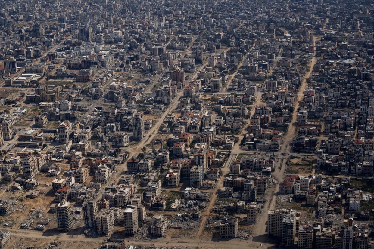 <span>Destroyed buildings seen from above in the Gaza Strip. </span><span>Photograph: Léo Corrêa/AP</span>