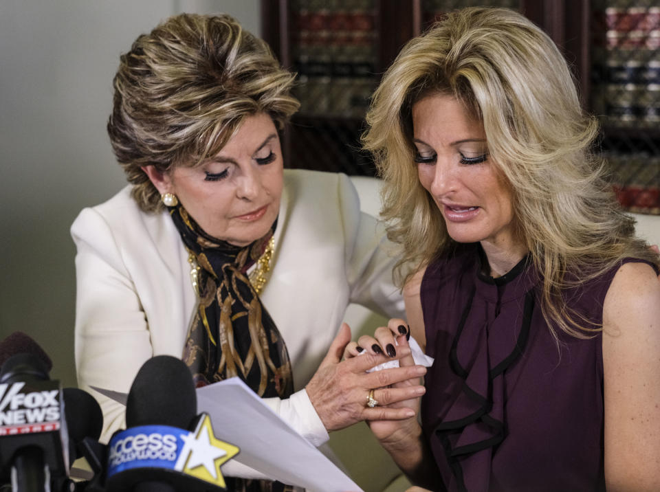 Attorney Gloria Allred, left, comforts Summer Zervos as Zervos, a former contestant on