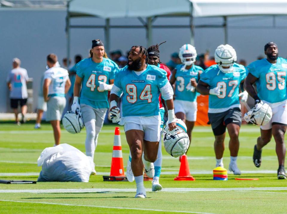 Miami Dolphins defensive tackle Christian Wilkins (94) runs on the field during NFL football training camp at Baptist Health Training Complex in Hard Rock Stadium on Sunday, July 30, 2023 in Miami Gardens, Florida.