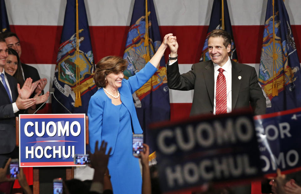 Gov. Andrew Cuomo, right, celebrates with his running mate, Lt. Gov. Kathy Hochul after defeating Republican challenger Rob Astorino, at Democratic election headquarters in New York, Tuesday, Nov. 4, 2014. (Kathy Willens/AP)