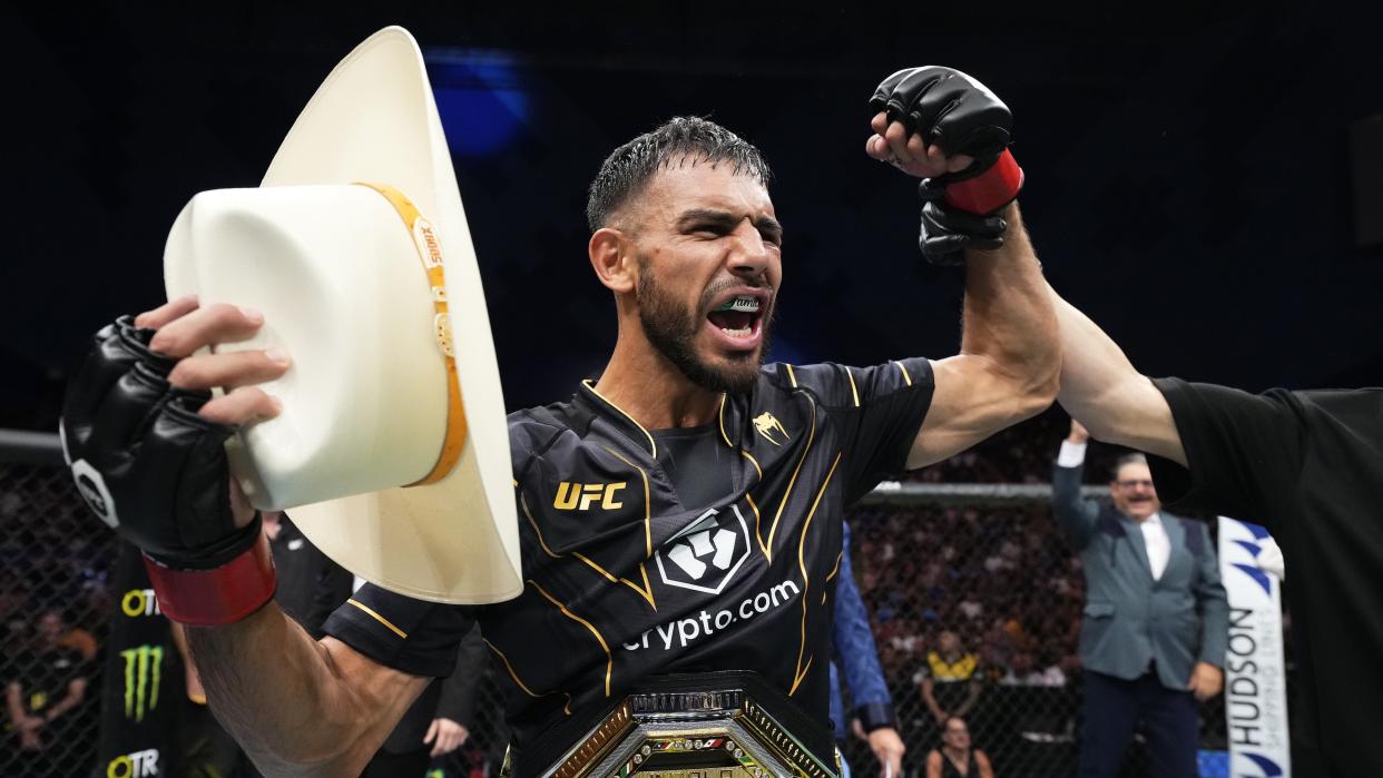  air Rodriguez of Mexico reacts celebrates with his team following his submission victory over Josh Emmett of the United States  